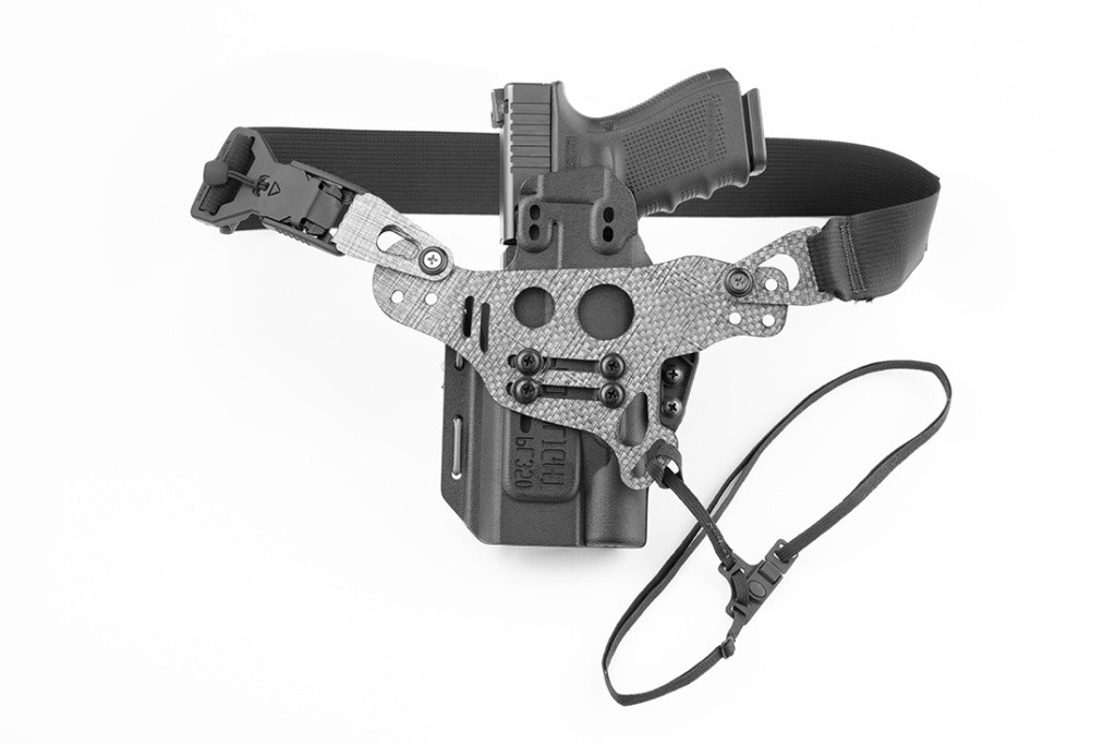Photo of fully assembled Light Bearing Enigma, holster, and Glock 19 pistol.