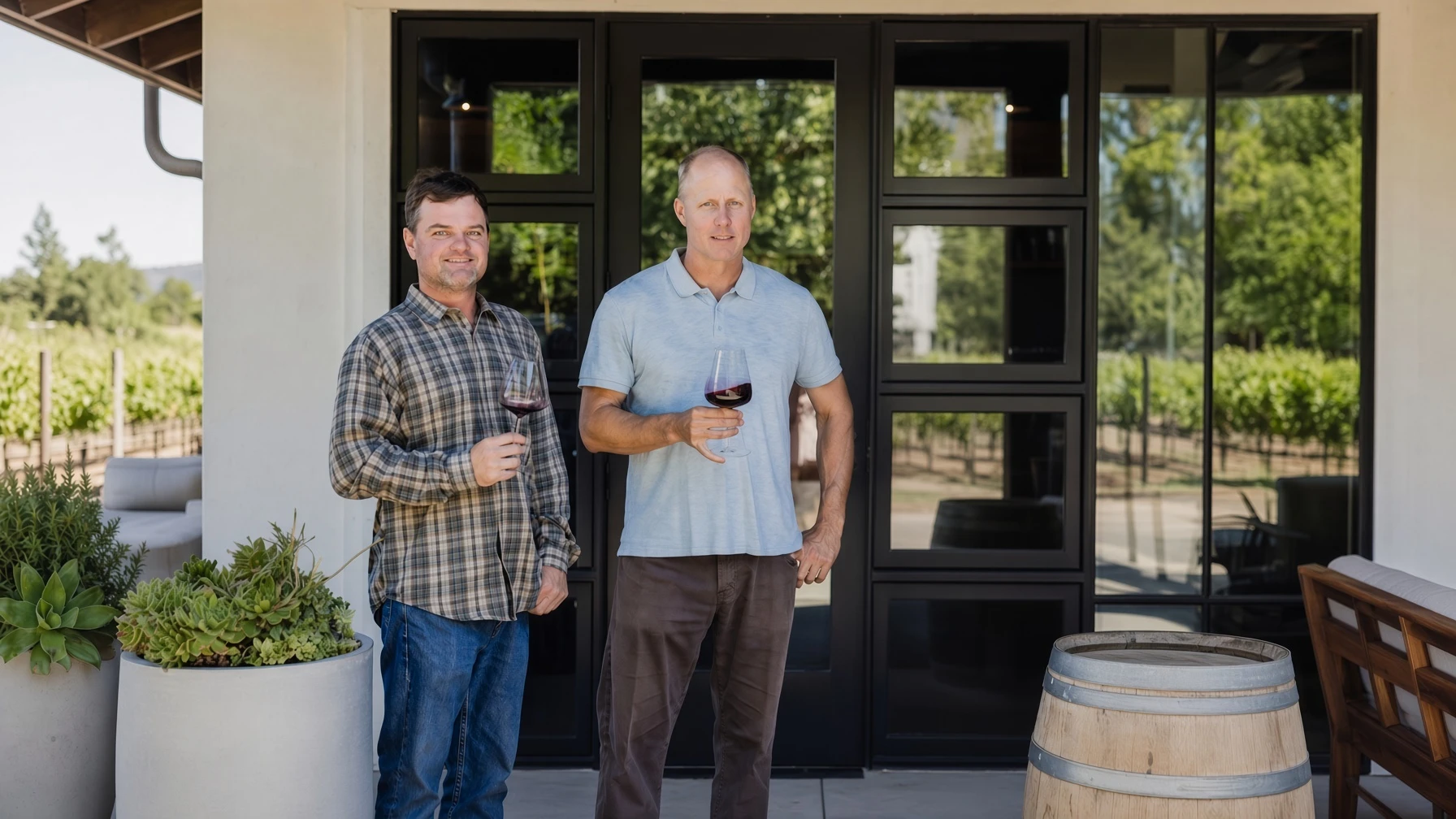 Matthew Wallace wine team holding glasses at a Napa Valley vineyard estate