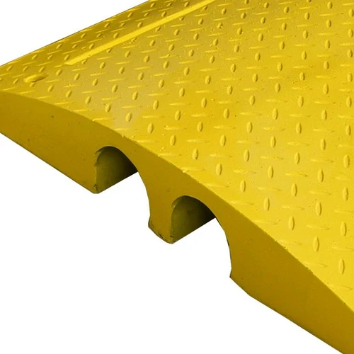 Melba Swintex Yellow hose & cable cover access ramps, close-up view of the textured yellow surface and ramp holes for cables and hoses.