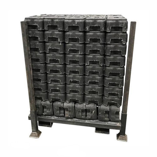 ZND Stillage For Rubber Block Feet, a stack of black rubber blocks stored on a metal frame for industrial use.