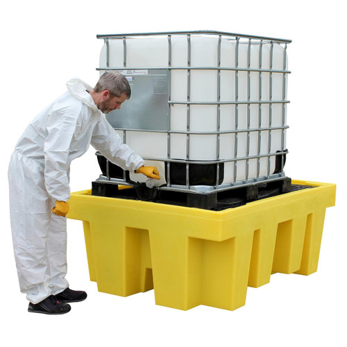 Romold BB1 Single IBC Spill Pallet Bund Grid Deck 1100L Sump, a yellow spill containment pallet with a metal grid deck holding an IBC container and a safety worker inspecting it.