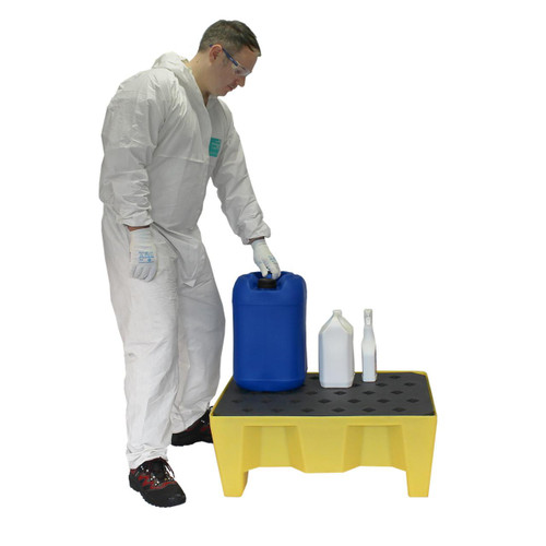 Romold 70 Litre Drip Spill Tray On Legs With Mesh Grid ST70, a yellow spill containment tray with mesh surface and sturdy legs, designed for industrial chemical and liquid containment, with a person in protective gear demonstrating its use.