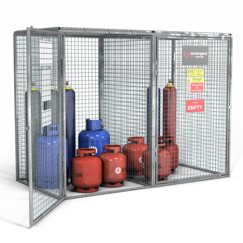 Armorgard GGC66 Armorgard Gorilla Gas Cage, metal storage cage with grid panels containing multiple gas cylinders in both blue and red colors, with warning and safety signs on the front panel.