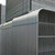 ZND 3.5m Round Top Anti-Climb Temporary Heras Fence Panel, close-up of galvanized steel fencing panels with curved tops and horizontal support bars.