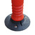 Melba Swintex Flexi cylinder 1 Meter, close-up view of the orange flexible safety barrier post with black base and mounting hardware for road safety and construction zones.