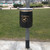 Melba Swintex 35L Doggy Waste Bin Post / Wall Mount, outdoor waste bin for dog waste disposal mounted on a pole in a park setting.