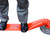 Melba Swintex Flexi cylinder 75cm, flexible orange safety barrier tube on a flat surface with a person's legs standing on it.