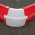 Oaklands Corner Section for EVO 1 & 1.5 Metre Barrier, red and white plastic corner safety barrier on asphalt surface.