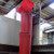 Oaklands 20 inch rubbish chute top hopper, red waste chute with lid and chain for industrial waste management.