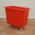 Excelsior 200 Litre Plastic Stock Trolley Watertight, red plastic storage trolley with wheels for industrial or warehouse use.