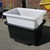 Excelsior 250 Litre Forklift Mortar Tub Black Recycled, large black mortar tub with white inner container, outdoor setting with brick wall and wheelbarrow in background.