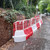 Oaklands Evo Corner Barrier Section Mini Mesh Panel, orange and white construction safety barrier along roadside.