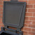 Excelsior 100kg 200L Coal Store Bunker Recycled Black Plastic, black plastic coal storage bunker against brick wall.