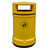 Roadware Derwent 120 Litre Outdoor Heritage Litter Bin, yellow outdoor waste receptacle with a top opening and a black symbol for litter disposal.