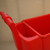 Excelsior Replacement Trolley Handle Coloured Plastic, close-up of red plastic handle attached to a red trolley container.