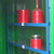 Empteezy CS2 Walk In Chemstor Storage Cabinet Holds 72 Containers, industrial safety storage cabinet with red containers inside.