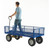 GPC Heavy Duty Mesh Sided REACH Compliant Trucks 500kg Load, blue heavy-duty mesh-sided truck with four rugged wheels and a person standing on it, carrying out transportation or hauling tasks.