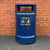 Roadware 120L Derwent Large Floor Mount Dog Waste Bin, blue outdoor waste receptacle with yellow text and dog waste symbols, designed for park or street use.