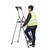 Climb IT GPC 3 to 8 Tread Double Decker Tool Tray Aluminium Stepladder, a sturdy silver aluminium ladder with a red tool tray and black accents, being used by a man in safety glasses and a yellow high-visibility vest.