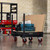 Armorgard FK2 Flexikart Worksite Material Handling Trolley, industrial black and red trolley with a flat platform, four swivel wheels, and upright handles for transporting tools and materials at construction sites.