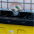 Jonesco Lockable Hard Covered IBC Bunded Spill Pallet HC1-YE-YE, close-up image showing the spill containment system and water outlet valve.