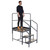 Climb IT GPC 1 to 3 Tread Climb-It Single Modular Platform, a sturdy metal tower with stairs and guardrails, featuring a person standing on the platform.