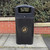 Roadware Langdale 90 Litre Square Hooded Litter Bin, black outdoor waste disposal bin with hood, plastic trash can with recycling symbol, designed for public places.