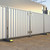 ZND Solid Hoarding Anti-Climb Vehicle Gate, sturdy white metal security gate with vertical bars and anti-climb features installed in outdoor setting.