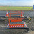 Ninja Guard Trench Bridge 1700 x 1000mm Foot Bridge & Trench Crossing, orange safety barrier and fencing set up on a road construction site with traffic cones and warning signs