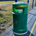 Dark green Cesar outdoor litter bin with concrete base & seagull flaps