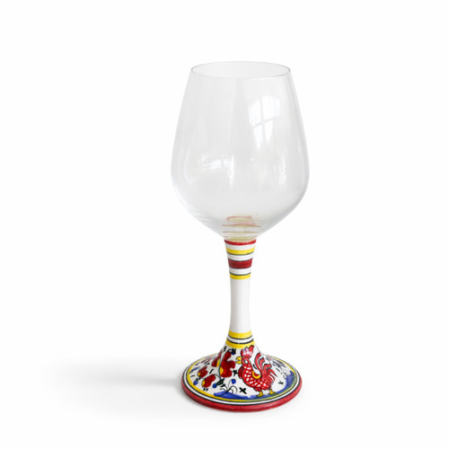 Close-up of hand-painted rooster on ceramic stemware.