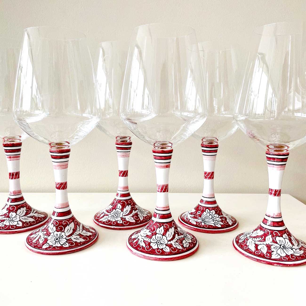 Ceramic and glass goblets with Italian decorations