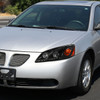 2005-2010 Pontiac G6 Projector Headlights w/ LED Light Strip (Matte Black Housing/Clear Lens)