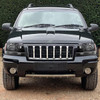 1999-2004 Jeep Grand Cherokee Factory Style Crystal Headlights w/ Amber Reflectors (Matte Black Housing/Clear Lens)