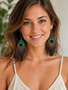 Peacock Feather Earrings Unique Double-sided  Five Inch with Purple Amethyst Beads on model front facing