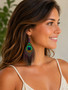 Peacock Feather Earrings Unique Double-sided  Five Inch with Purple Amethyst Beads on model profile view