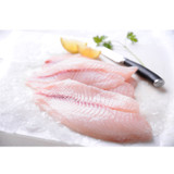 photograph of tilapia fillets next to a knife and lemon slices on ice