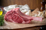 ribeye steak with bone in on butchers paper