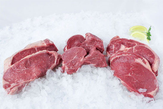 8 oz. filet mignons, 12 oz. boneless New York strip steaks, and 12 oz. boneless ribeyes in pairs on ice