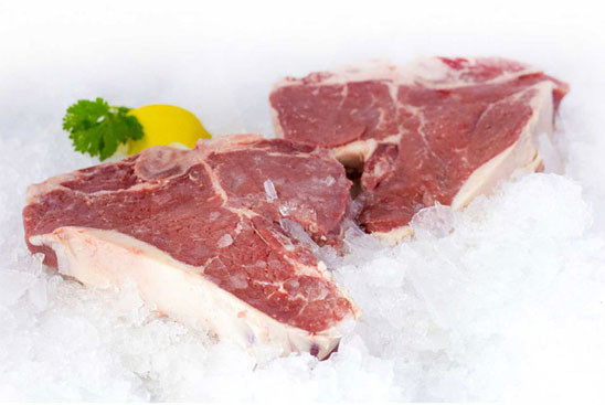 Two porterhouse steaks on a bed of ice