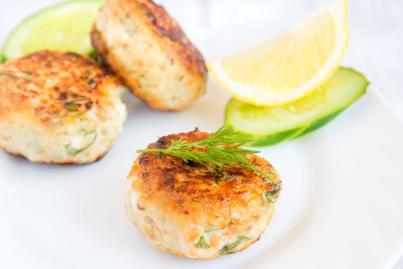 crab cakes on a plate, garnished