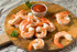 Shrimp on a circular wood block