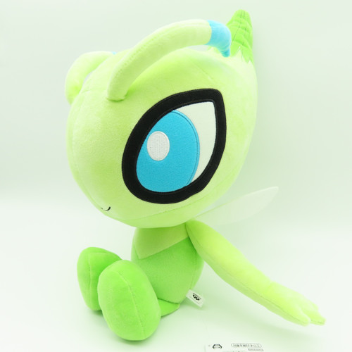 Official Pokemon Celebi Mecha Mofugutto large plush side view showing large blue eye.