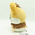 Side profile of the 26cm Hamtaro Detective plush toy highlighting the stitched brown bow.
