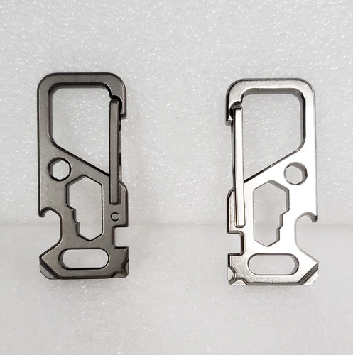 Titanium Carabiner Duo, on left is the Frosted (Matte) finish with the Polished finish on the right.  All on white background. Titanium Carabiner Duo, on left is the Frosted (Matte) finish with the Polished finish on the right.  All on white background.