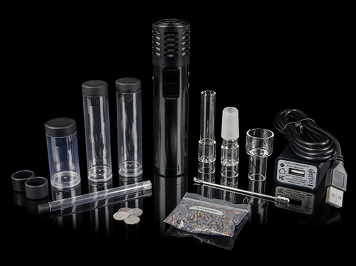 Arizer Air MAX out of the box with everything that is included with the purchase of the package from Arizer on black background.