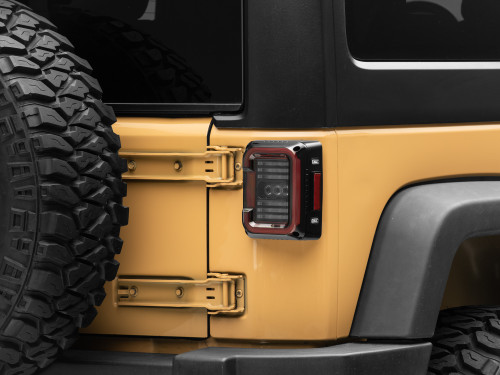 Raxiom J138358 - 07-18 Jeep Wrangler JK Axial Series LED Halo Tail Lights- Black Housing (Dark Smoked Lens)