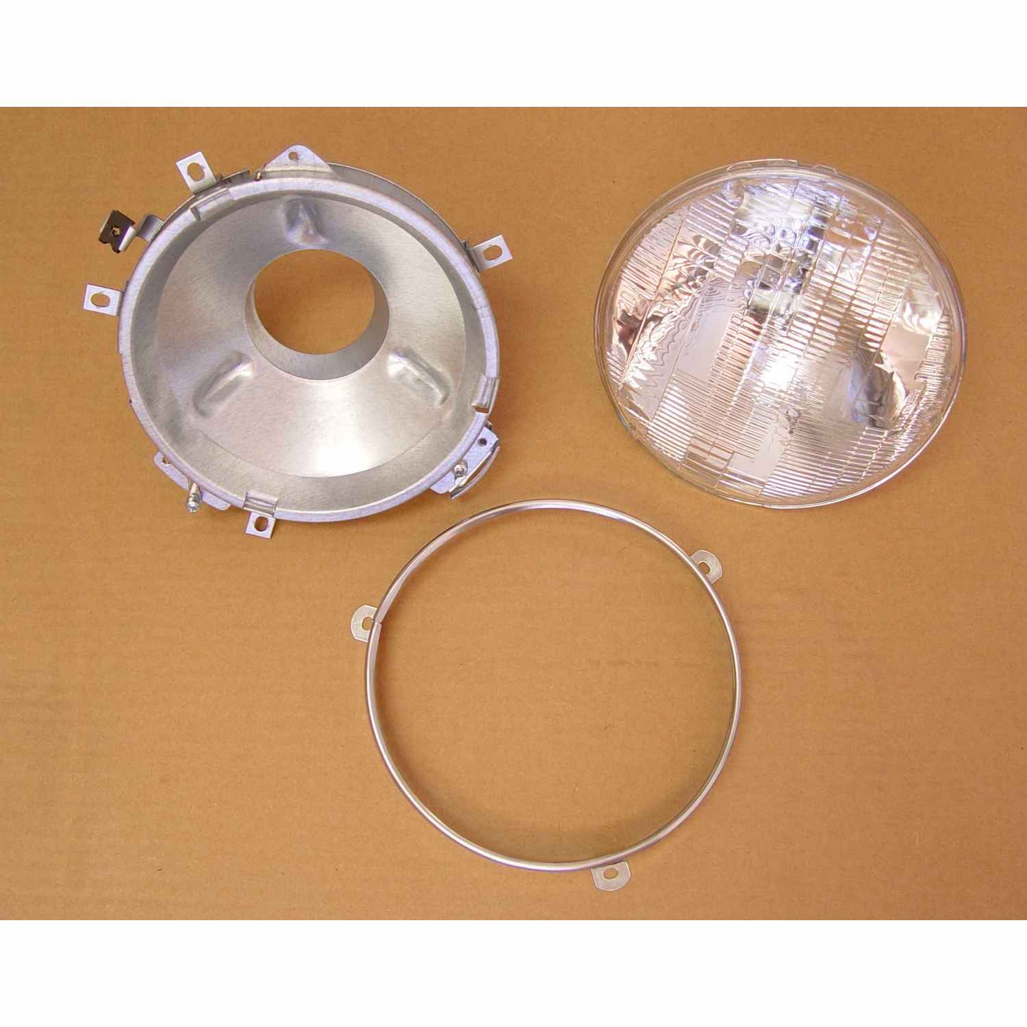 Omix 12402.01 - Headlight Assembly With Bulb 72-86 Jeep CJ Models Omix 12402.01 - Headlight Assembly With Bulb 72-86 Jeep CJ Models