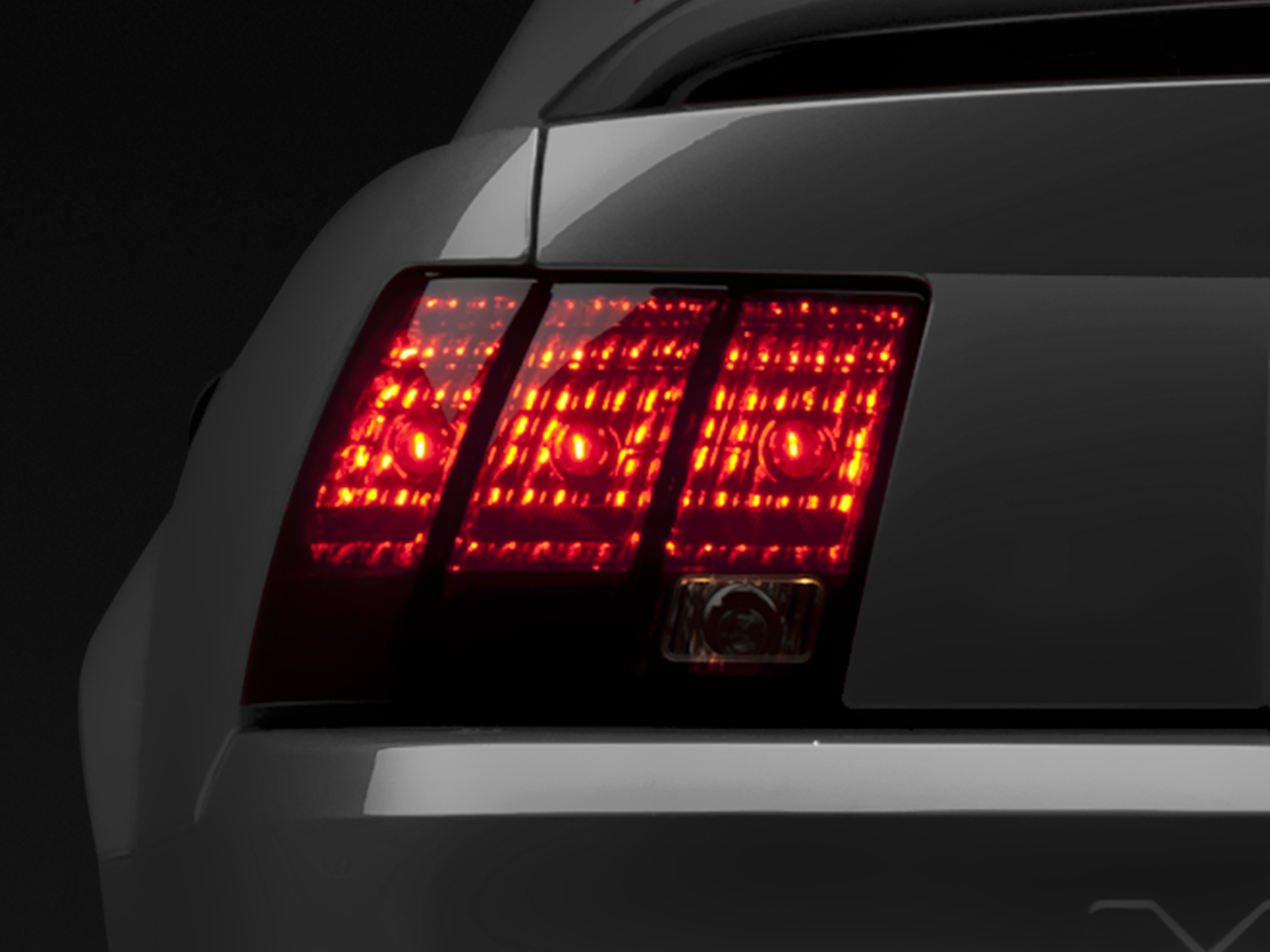 Raxiom 49080 - 99-04 Ford Mustang Excluding 99-01 Cobra Tail Lights- Black Housing (Smoked Lens) Raxiom 49080 - 99-04 Ford Mustang Excluding 99-01 Cobra Tail Lights- Black Housing (Smoked Lens)
