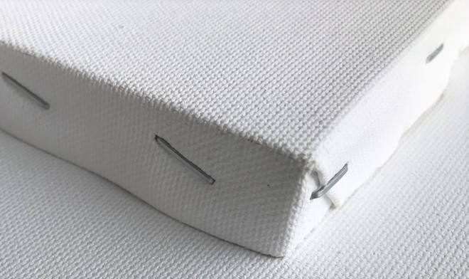 Smooth edge-stapled 3/4" deep portrait canvas featuring tightly stretched cotton for clean corners and a stable painting surface.